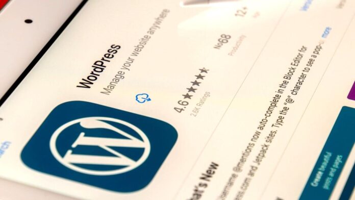 An iPad with WordPress admin screen visible